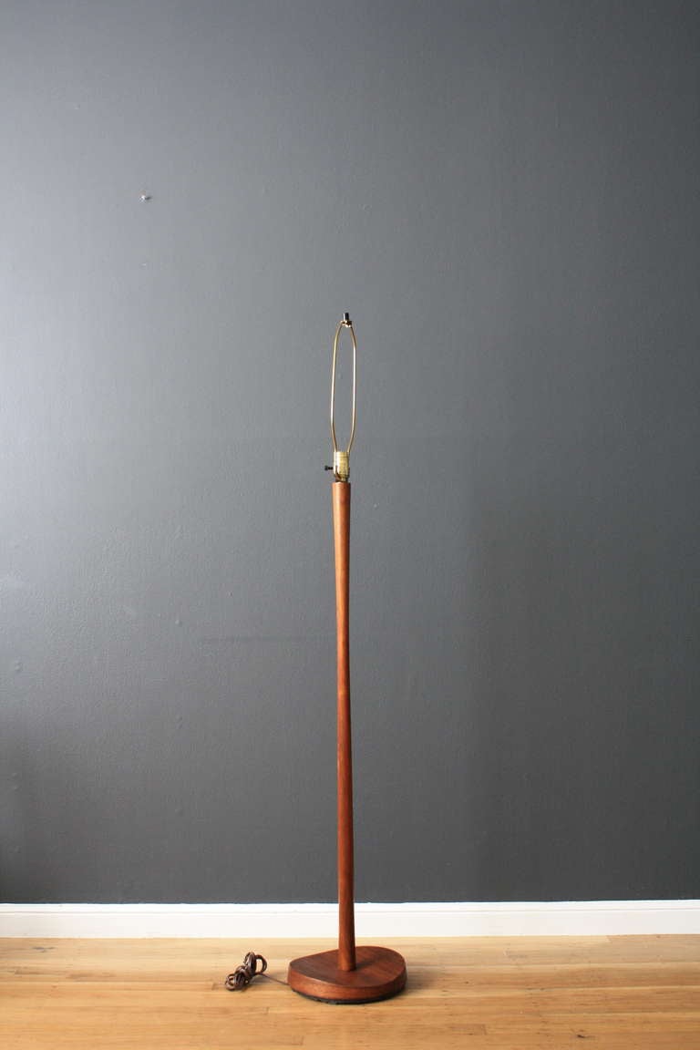 This is a vintage Mid-Century teak floor lamp. No lamp shade included.