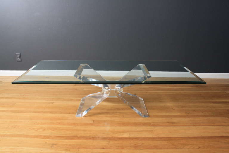 This is a vintage lucite butterfly coffee table with a glass top in the manner of Leon Frost.