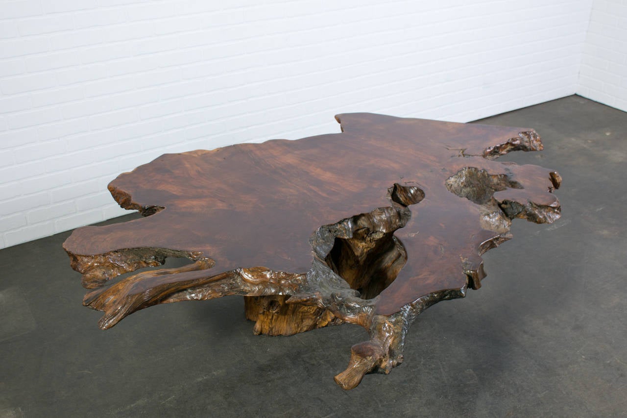 This is a large redwood slab coffee table. Beautiful grain and organic shape.