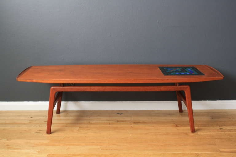 This is a vintage Mid-Century teak coffee table with mosaic in-lay by Arne Hovmand Olsen for Mogens Kold.