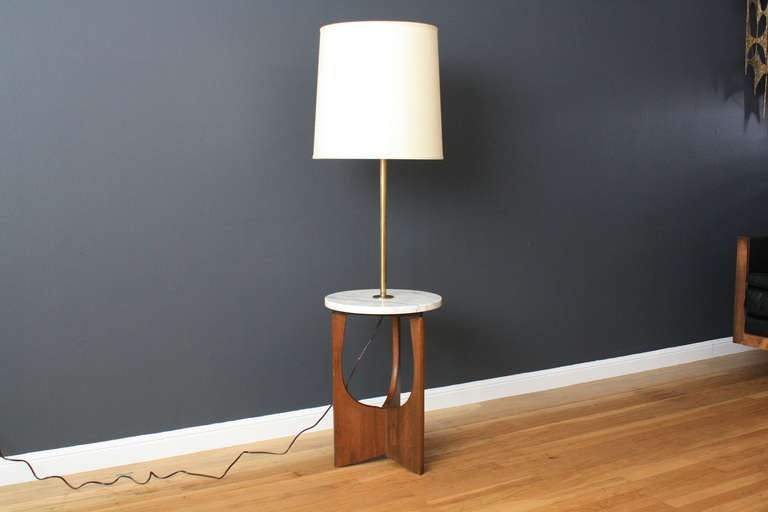 This is a vintage Mid-Century floor lamp with a marble table. Shade is not included. Marble table top is stamped Made in Italy.