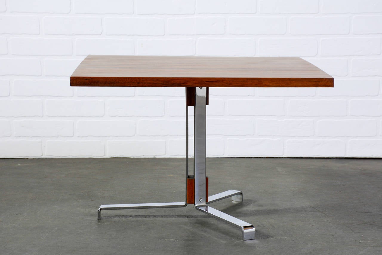 This is a vintage Mid-Century side table with a chrome and wood base and an oak, beech, and walnut top.
