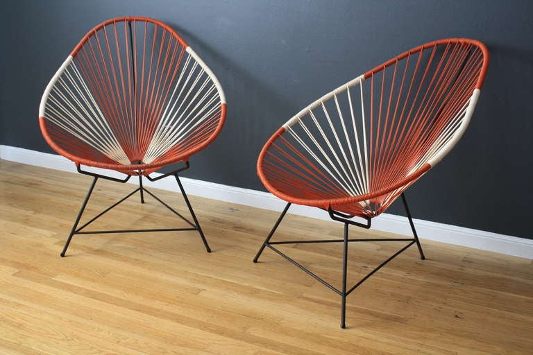 This is a pair of vintage Mid-Century Acapulco chairs.

