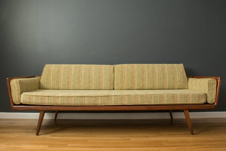 This is a vintage Mid-Century sofa by Mel Smilow for Smilow-Thielle in the 1950's. The solid walnut frame is finished on all sides, and the cushions have the original upholstery.