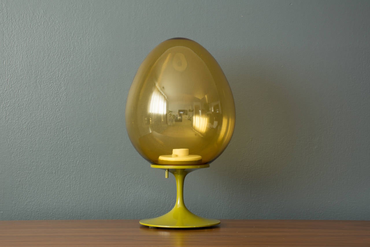 This is a Mid-Century Modern green powder coated steel Stemlite table lamp designed by Bill Curry for Design Line Inc. in 1965.  It has  the original egg shaped glass shade.