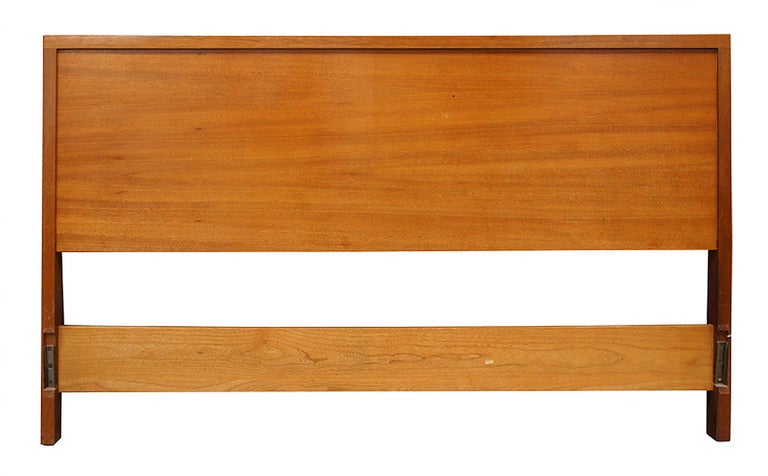 This Mid-Century Modern full sized bed frame by Paul Laszlo for Brown Saltman is rendered in solid blond mahogany. The bed is stamped beneath 