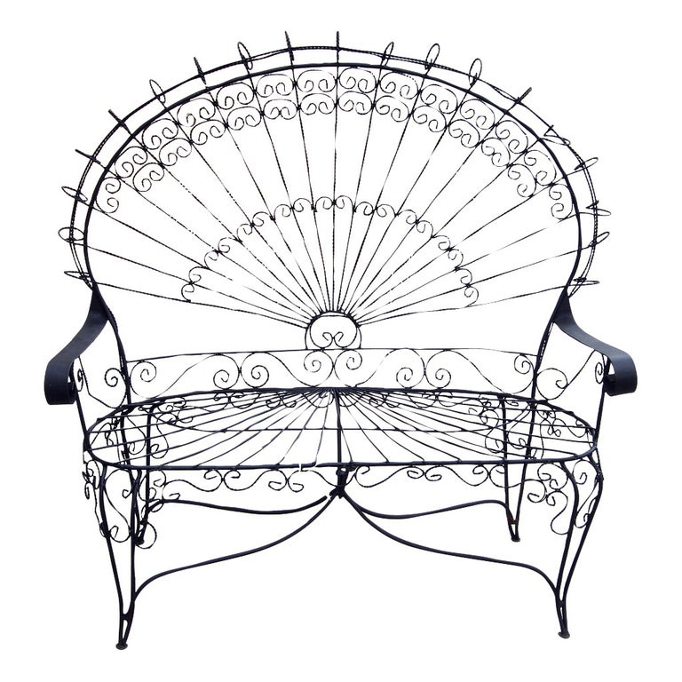 This intricate Victorian style wrought iron settee / love seat is known as the 