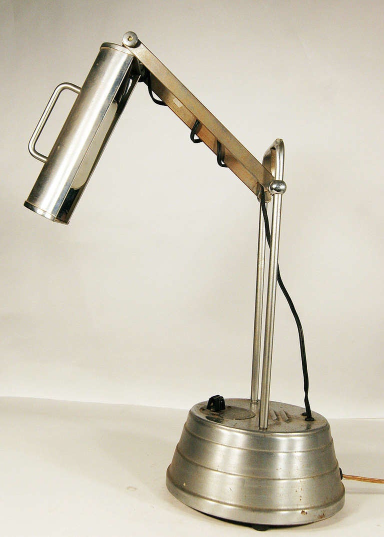 Vintage Sun Kraft Machine Age tanning lamp with timer that has been converted into a desk lamp. USA, Circa 1930 by Sun Kraft 

Condition: Fair lamp shows signs of minor rust and age, no dents or damage of any kind.

Height: 16