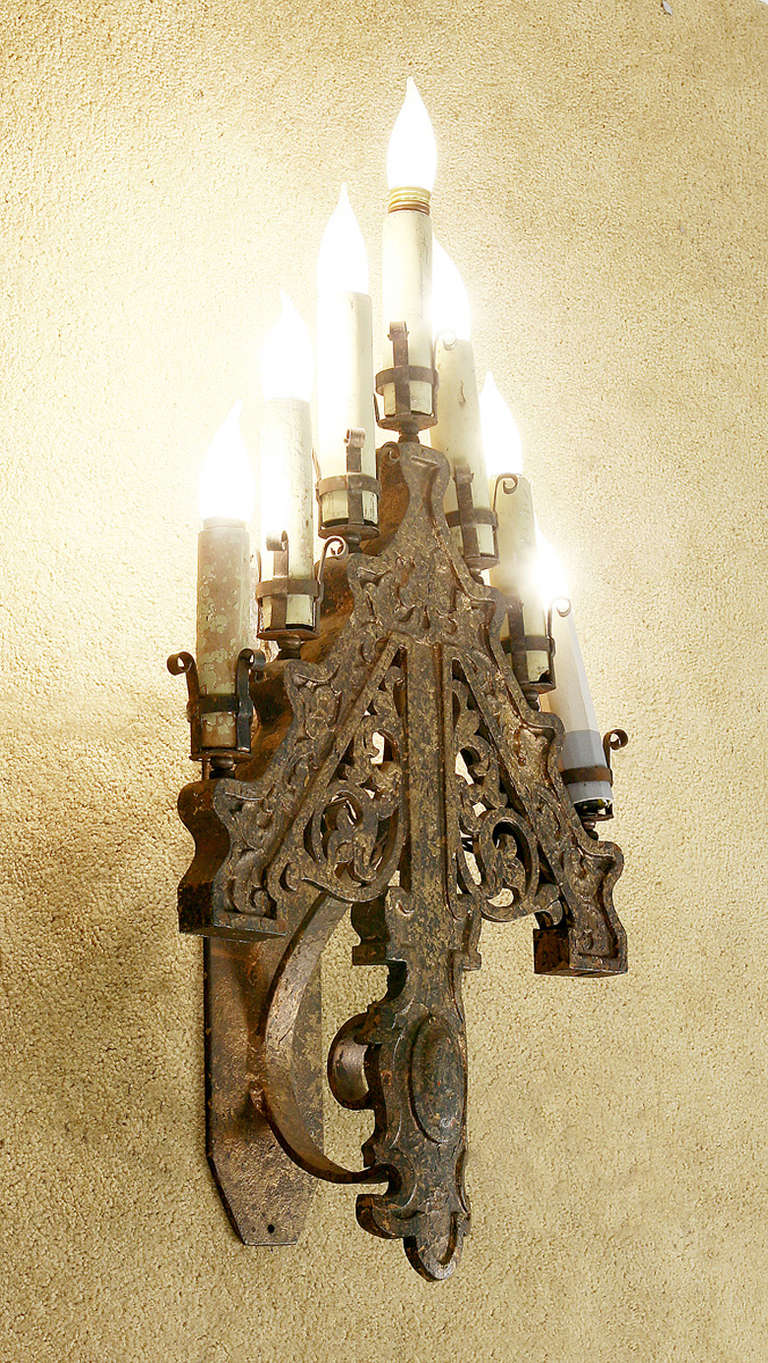 Set of six late Victorian French Gothic style iron sconce or candelabra converted to electric.