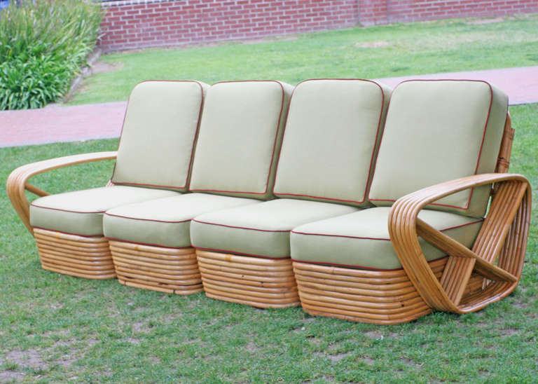 Square pretzel rattan sectional sofa designed by Paul Frankl. This sofa features a stacked rattan base with six strand square pretzel arms and is divided into a four personal sectional.

Please inquire about additional pieces