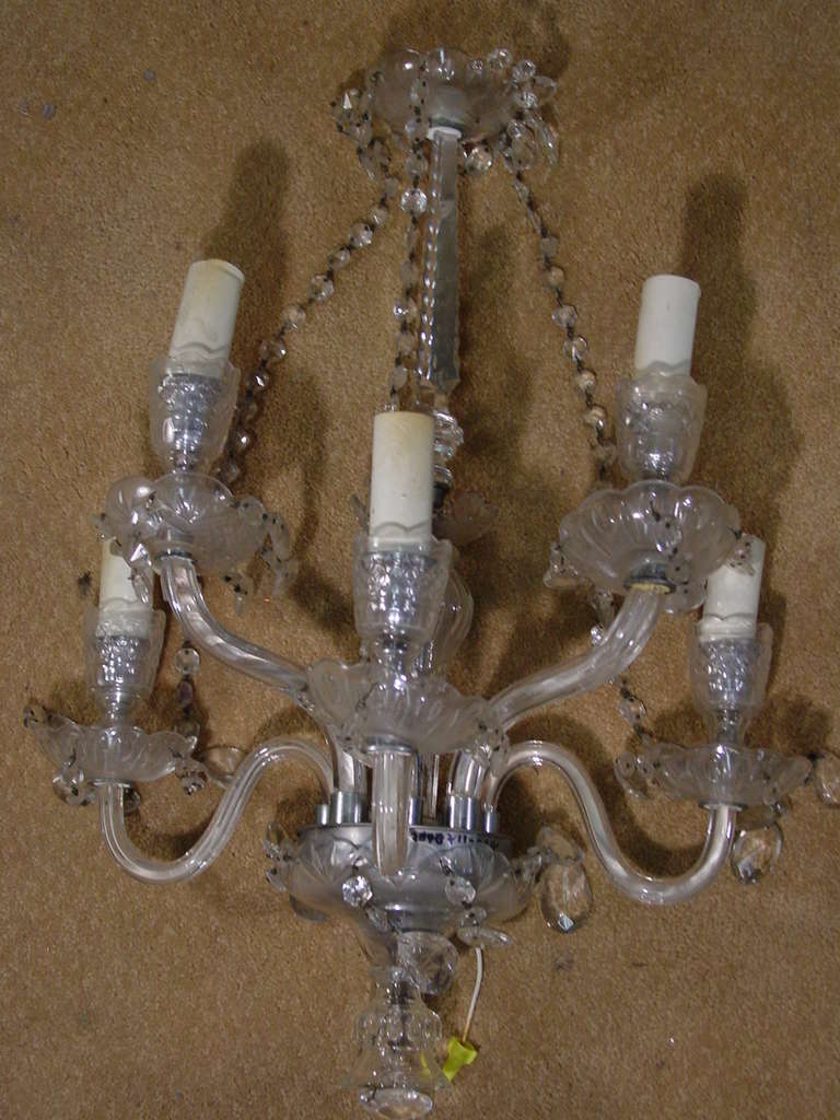Stunning pair of crystal comeragh cut crystal wall sconces by Waterford Crystal. Each sconce features 5 arms with crystal accents.

Please inquire us if you would like a different quantity, up to 5 are available upon request.