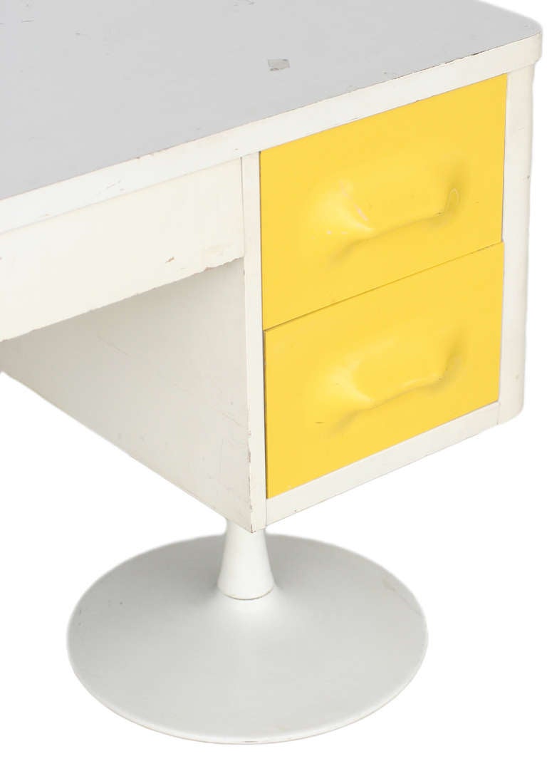 Mold injection plastic drawer panels in white painted case with white laminate top on pair of painted cast metal 'Tulip' pedestal legs. An homage to Raymond Loewy. Produced by Broyhill. From the Premier Collection.

Back is finished in white so is