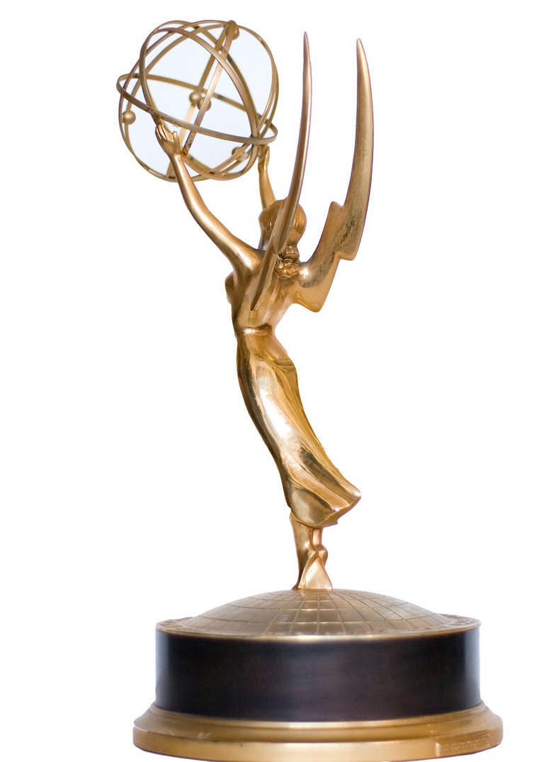 A fantastic Emmy Award statuette originally awarded for Prime Time Television. 

The statuette was first designed in 1948 by television engineer Louis McManus. He used his wife as a model, adding wings and the atom. The wings of the statue