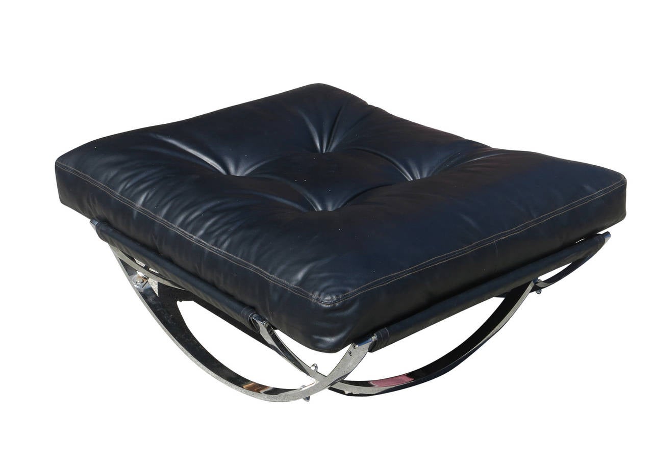 This 1970s Milo Baughman lounge chair with ottoman features a unique, interlocking chrome frame and a sumptuous tufted leather upholstery.

Ottoman: 15