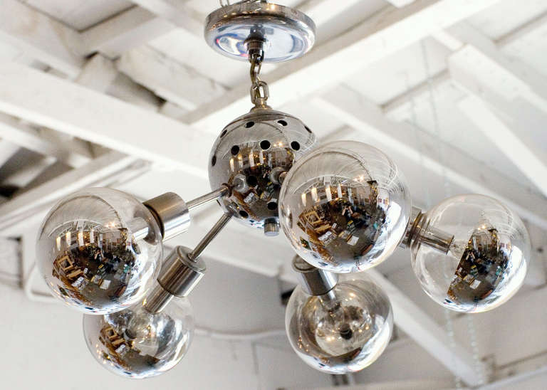 Chromed Sputnik chandelier with 5 arms. Each arm features silver tipped glass globes that surround a single bulb.