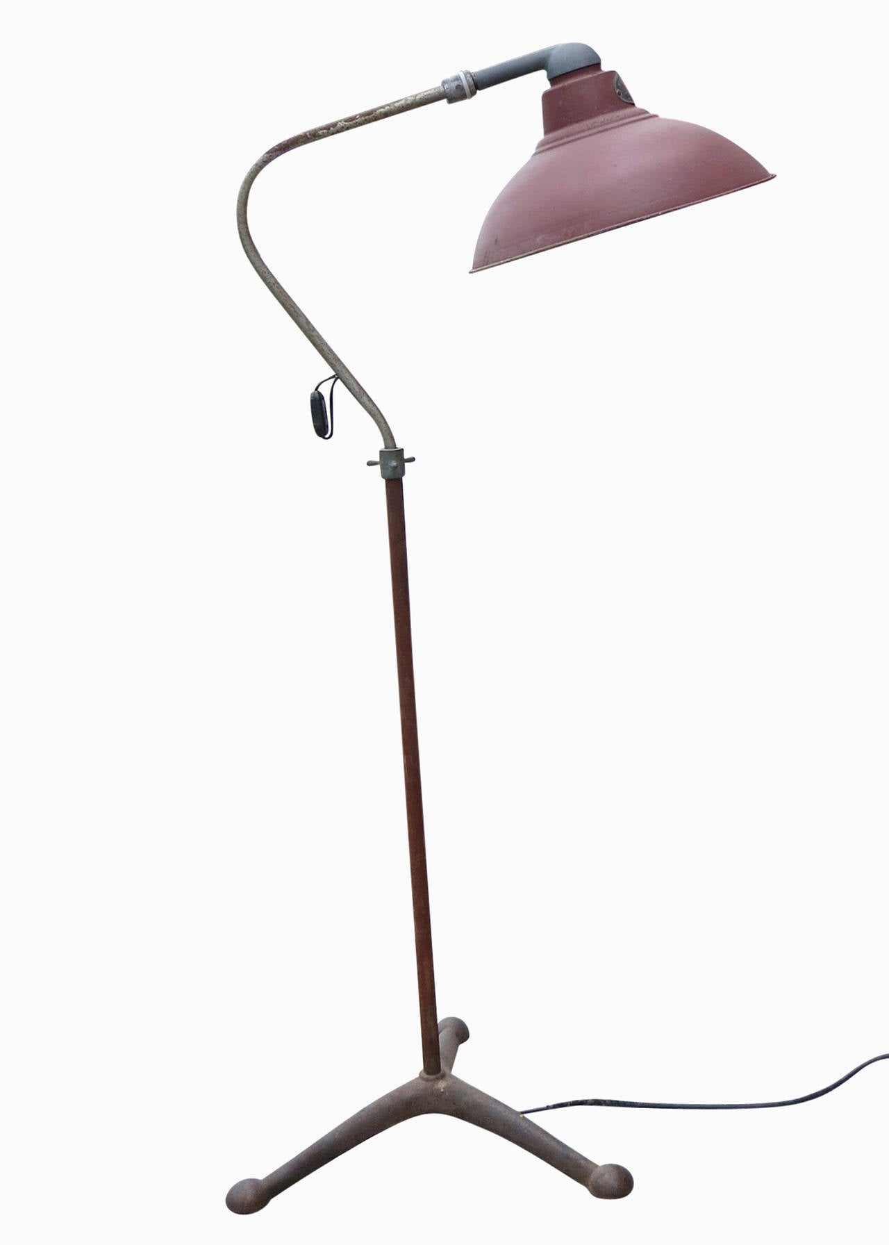 This desert air maker Industrial lamp features a heat tanning light which has been converted into a reading lamp. The lamp is an all metal construction with a unique machine age Industrial style and build. 

The head has an adjustable height of