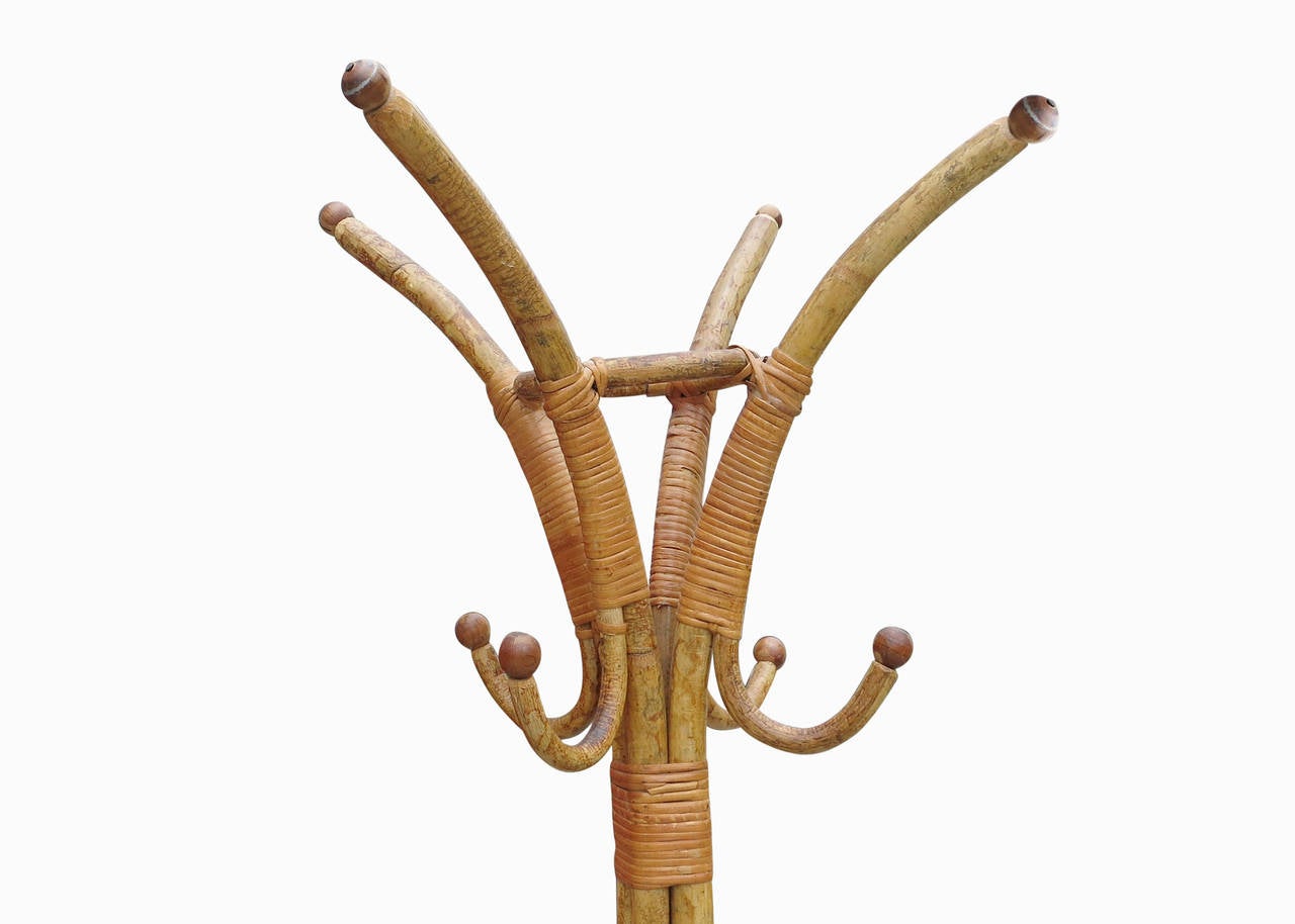 Built in Italy with the finest quality of rattan available, this Franco Albini style Tiger Rattan coat rack is decorated in extensive wicker wrappings. The coat rack contains eight hooks for use. 

Refinished to new for you.

All rattan, bamboo