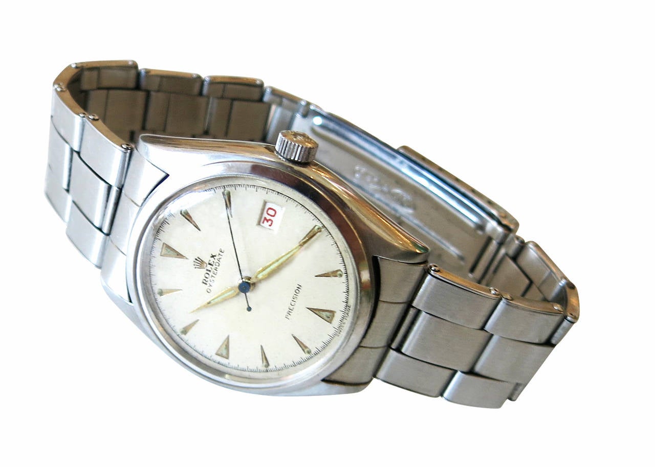 Dear Customer, I have marked many of my items for the 1stdibs Saturday Sale, take a look and save from 20% to 50% now. Take a look at all of these items; https://goo.gl/hNLz4x

The piece is a very sharp 1953 Mens Rolex Oyster Date watch that comes