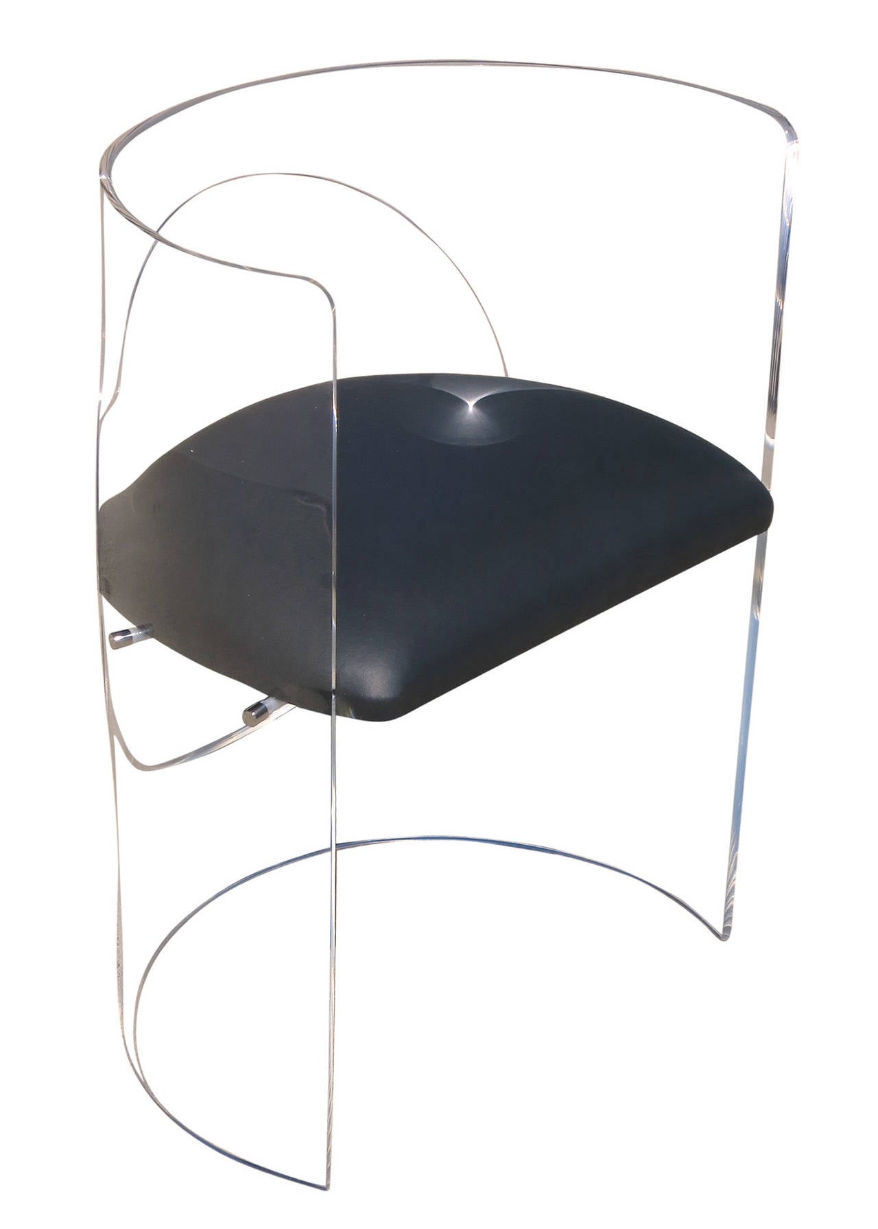 This Mid-Century style armchair by the famed designer Charles Hollis Jones features a wrap-around Lucite frame that envelops you while sitting on a floating black vinyl seat.

This chair is made-to-order by Charles Hollis Jones in his Los Angeles