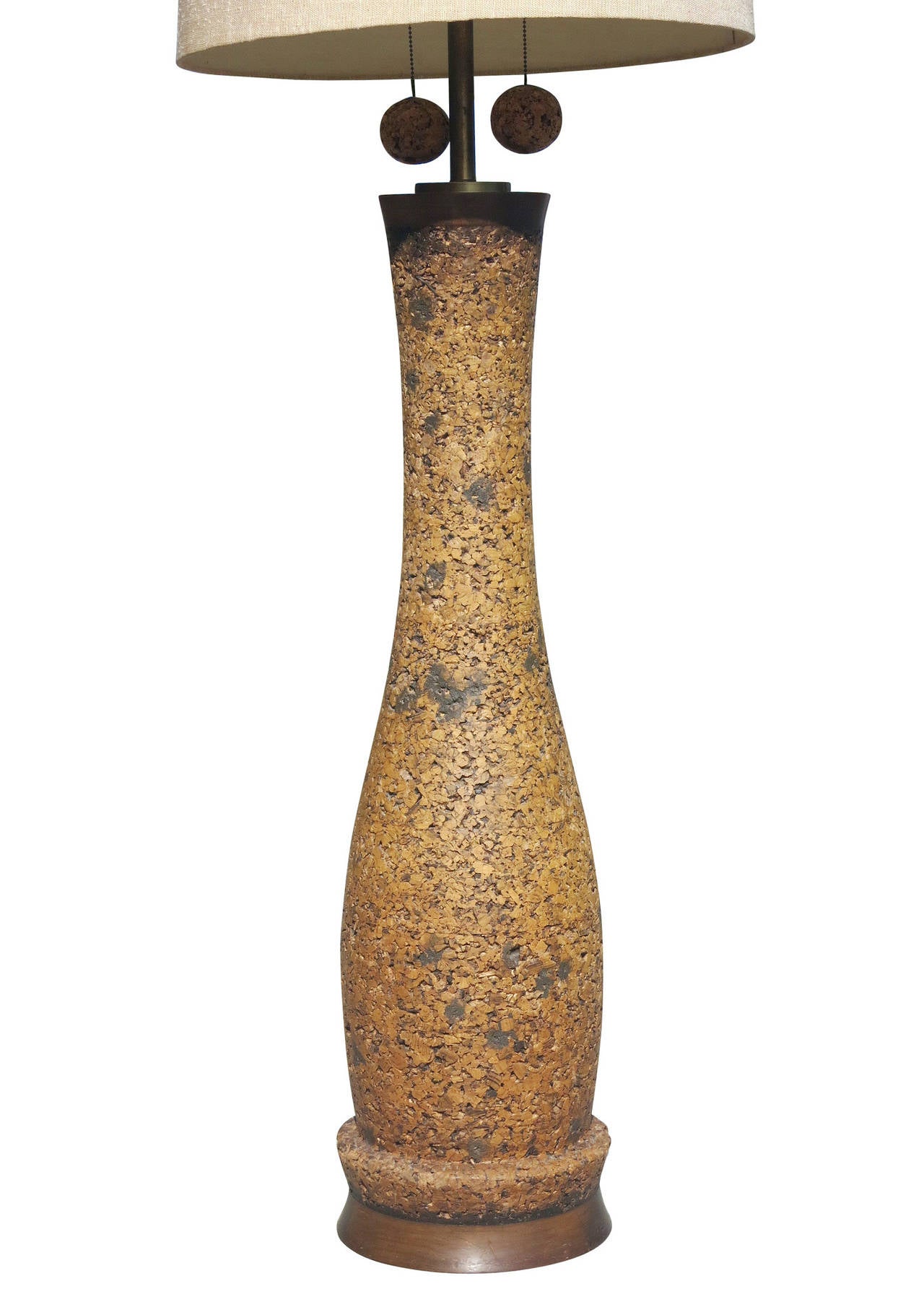 Milo Baughman style cork floor lamp, circa 1950, with brass stem and cork pulls. This monumental 80