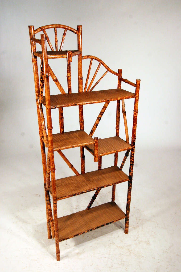 Antique circa 1900s six levels, tiger bamboo wall shelf with handwoven rice mat. 

All bamboo has been painstakingly refurbished using the finest materials by master craftsman under the supervision of Harvey Schwartz.