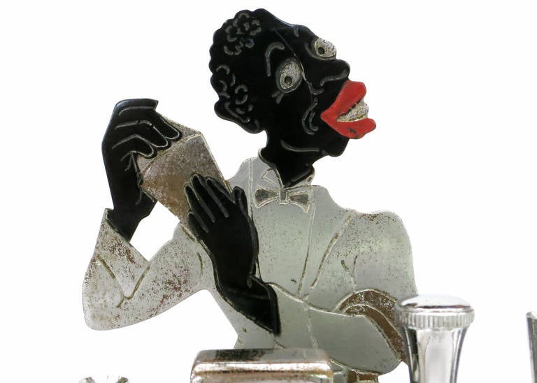 Rare circa 1936 Ronson desk top Touch-Tip lighter featuring a Jazz era bartender shaking a martini behind his Streamlined Art Deco speakeasy era bar. 

This Desk features a flit touch tip lighter for easy lighting of cigarettes and cigars. The top