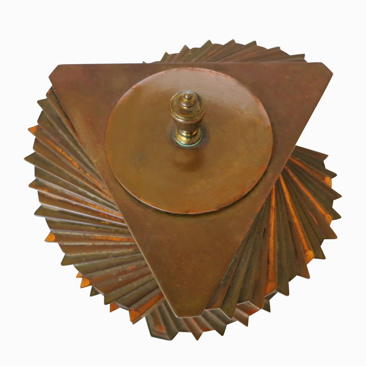 This rare Art Deco brass and copper lidded box (originally designed for cigarettes) was designed, patented and produced by John Otar circa 1928. The box is composed of individual triangular plates stacked to create a spectacular twisting spiral form