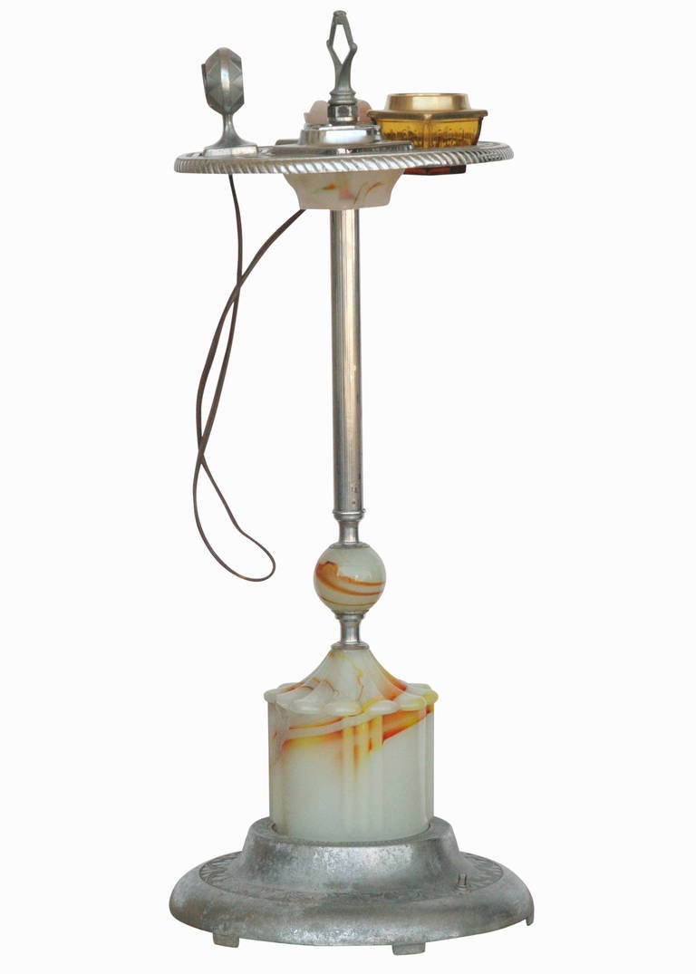Chrome Art Deco ashtray stand featuring decorative orange and white swirl glass accents with 3 glass ashtrays and a an electric lighter.