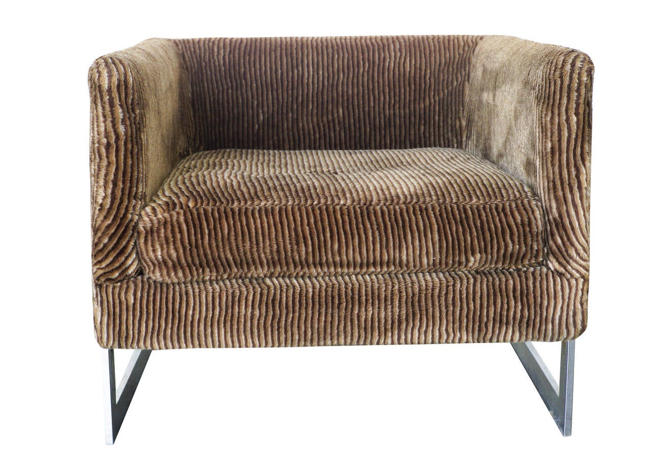Architectural club chair upholstered in light chocolate velvet corduroy by Milo Baughman for Thayer Coggin. This chair features an asymmetric chrome frame fixed to a velvet corduroy cube seat which from certain angels gives an almost floating