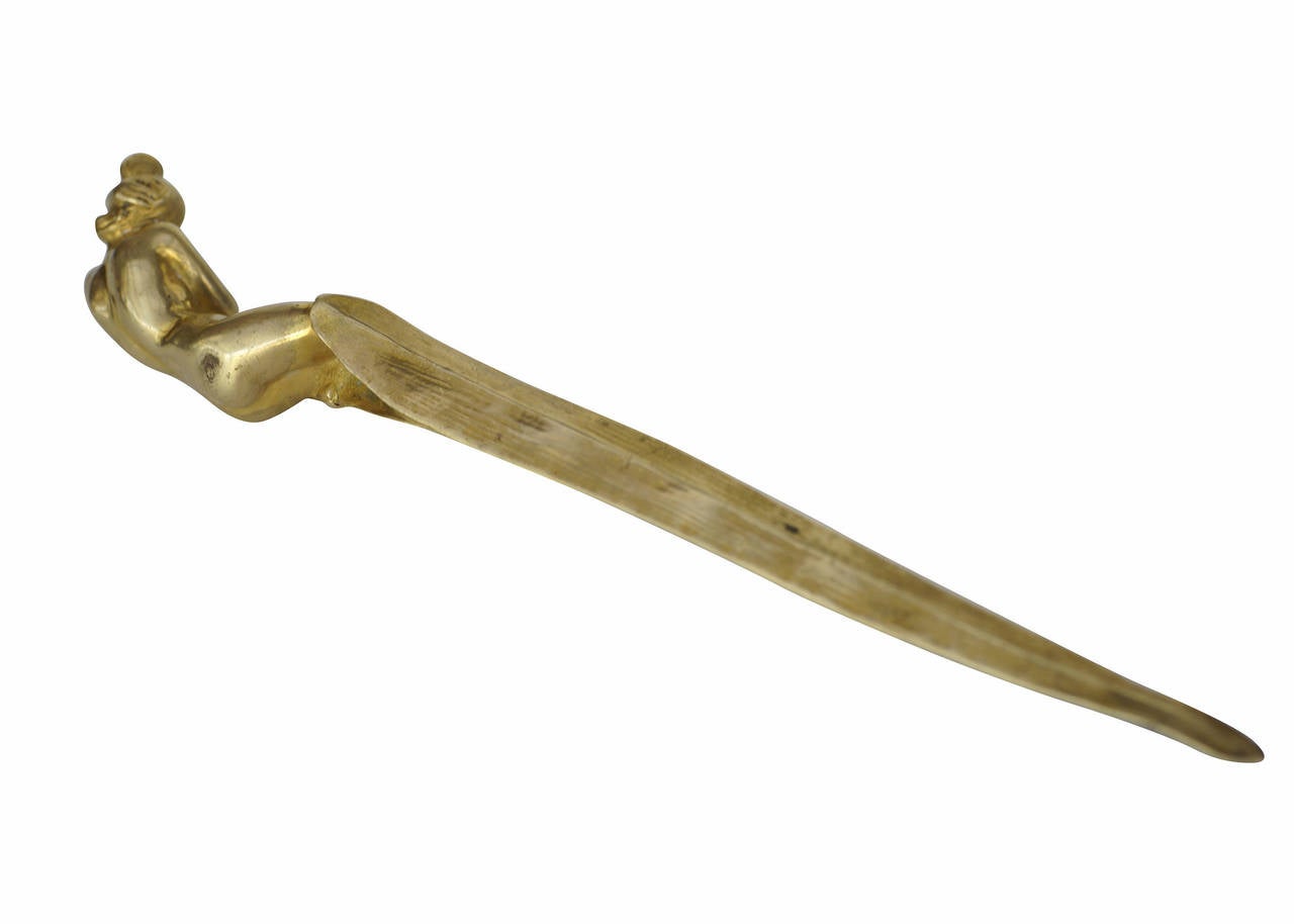 Art Nouveau gilded bronze letter opener signed Leo Laporte Blairsy featuring a nude sculptural women covering eyes, circa 1900. The 

Leo Laporte Blairsy (1865-1923) is known for his functional yet decorative pieces, especially where lighting is
