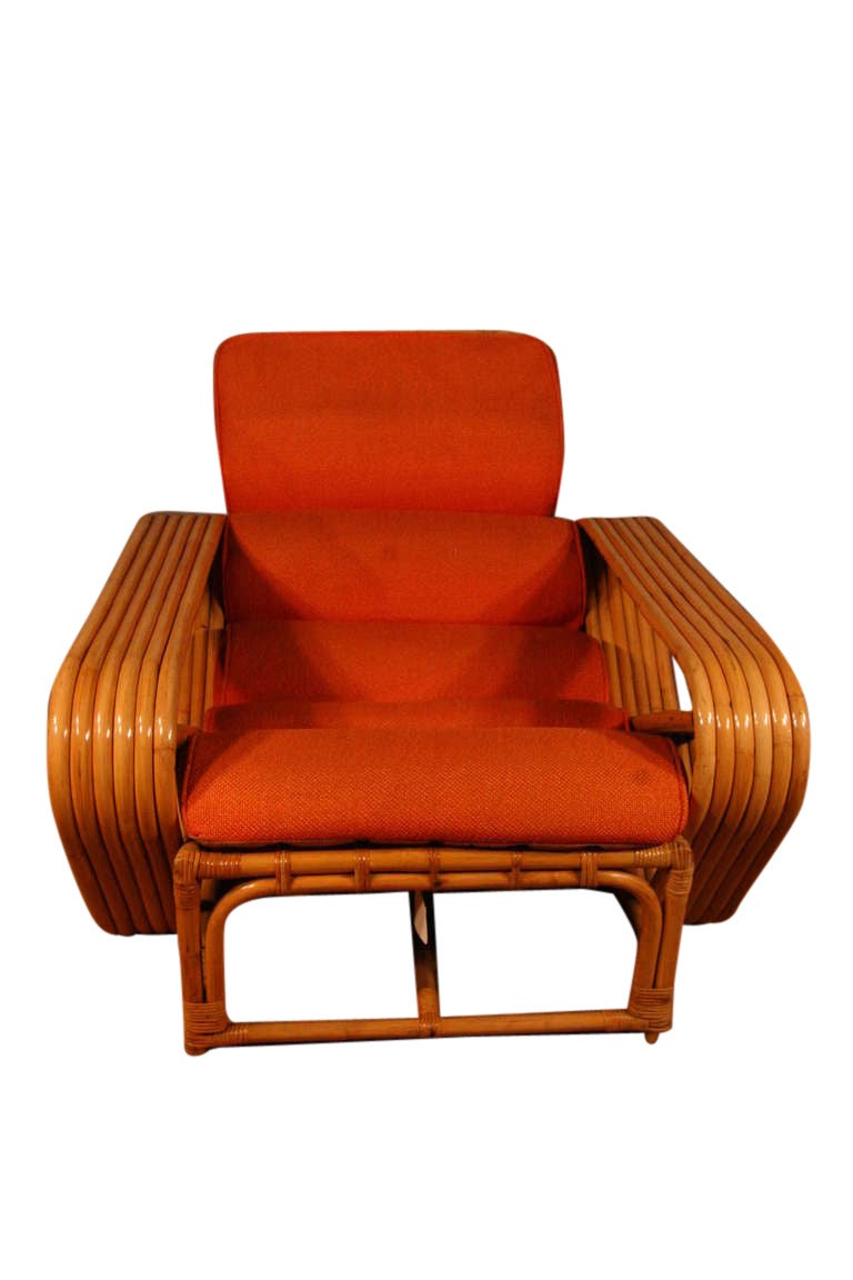 Designed in the manner of Paul Frankl, this six-strand, rattan lounge chair features square pretzel arms with matching Ottoman. 

Lounge Chair- 29