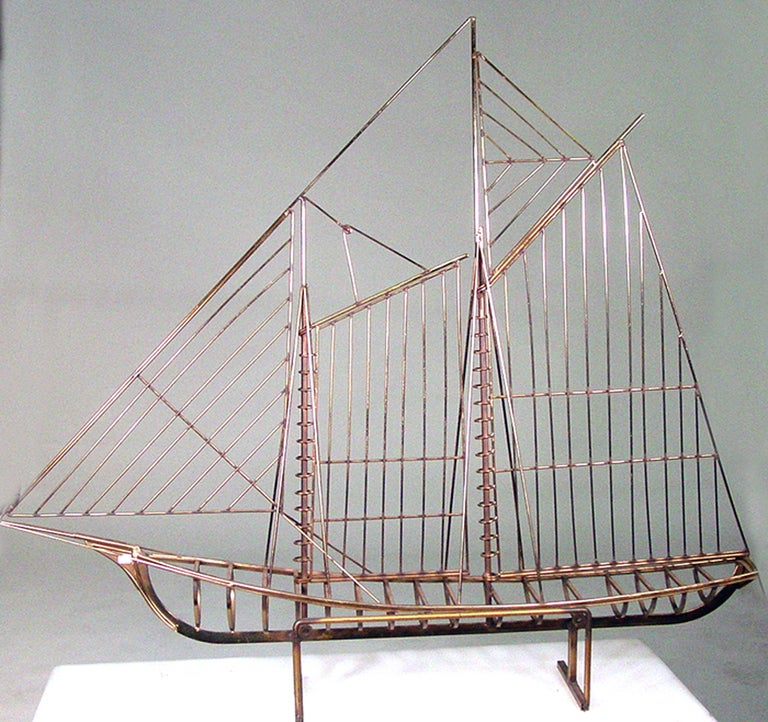 This classic skeleton sailboat sculpture by Curtis Jeré for Artisan House is skillfully rendered in brass and remains one of the company's most collectable designs. The sculpture may be displayed on a tabletop or mounted on the wall.