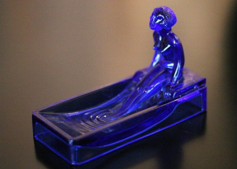 This 1970s re-edition of a 1927 Art Deco H. Hoffman Blue art glass soap dish / ring tray features a nude female figure bathing in a tub.

We have five different colors available white, blue, frosted green, black and pink. Each is new old stock