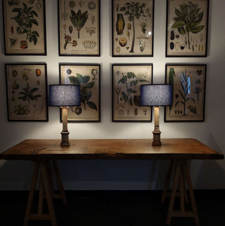 A very handsome pair of table lamps. The ionic column is a classically proportioned design, and the marble from which these were carved is gorgeously veined. 

The dimensions of the shades are 13