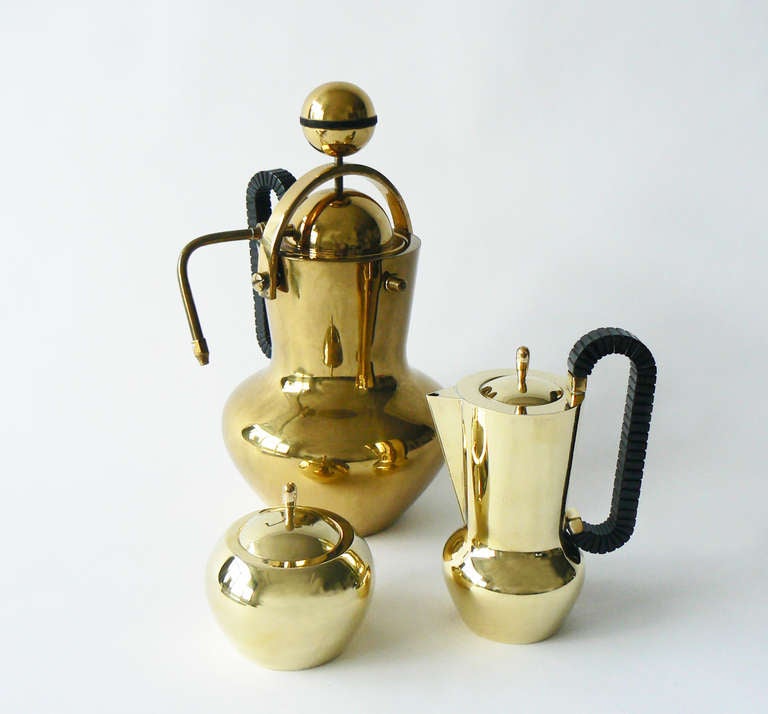 This 1930 electric Italian brass percolator is featured in Taschen’s Design Classics 1880-1930. With creamer and covered sugar bowl. In excellent vintage condition.