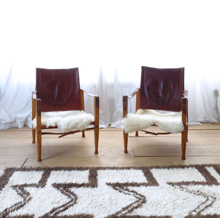 Kaare Klint is considered the father of modern Danish design, and these classic Safari chairs justify that title. The seat height is low, and the back pivots. Stretch your legs out, tilt back, do a little stargazing. The original leather of this