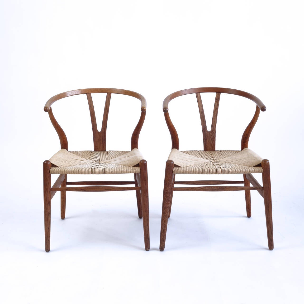 The Wishbone chair was one of Hans Wegner's first designs for Carl Hansen & Son, in 1949, and has been in continuous production since 1950. It was one of a series of designs that Wegner based on portraits of Danish merchants seated in ming