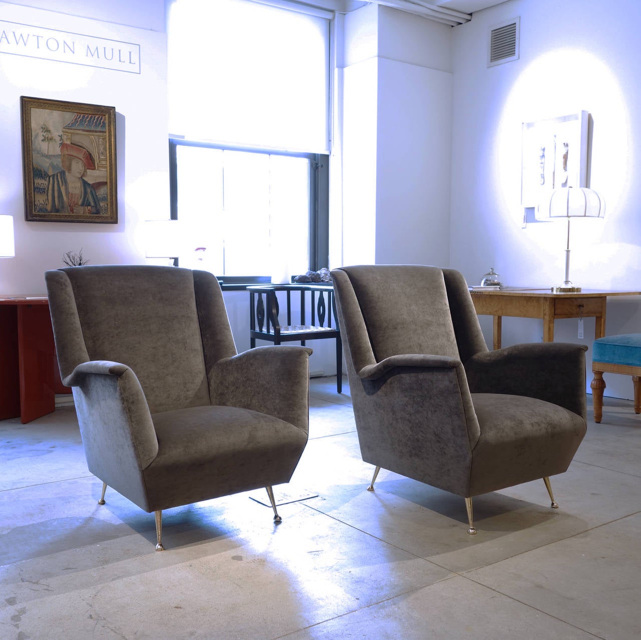 This generously-proportioned pair have been newly restored and recovered in a handsome gray velvet. They are of a set with a sofa (also pictured), and can be purchased together with it or separately.
