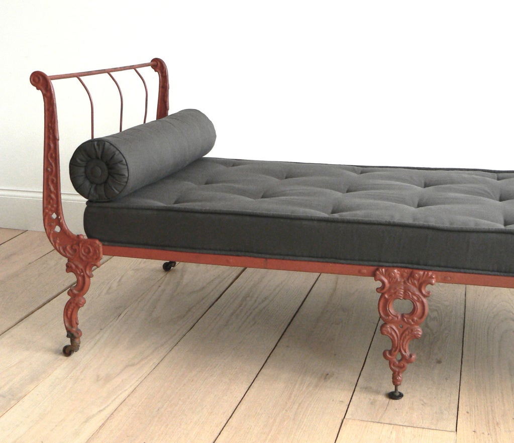 This stylish 19th century creation is French, cast iron, painted a well-aged brick red, and can be folded up (to 30