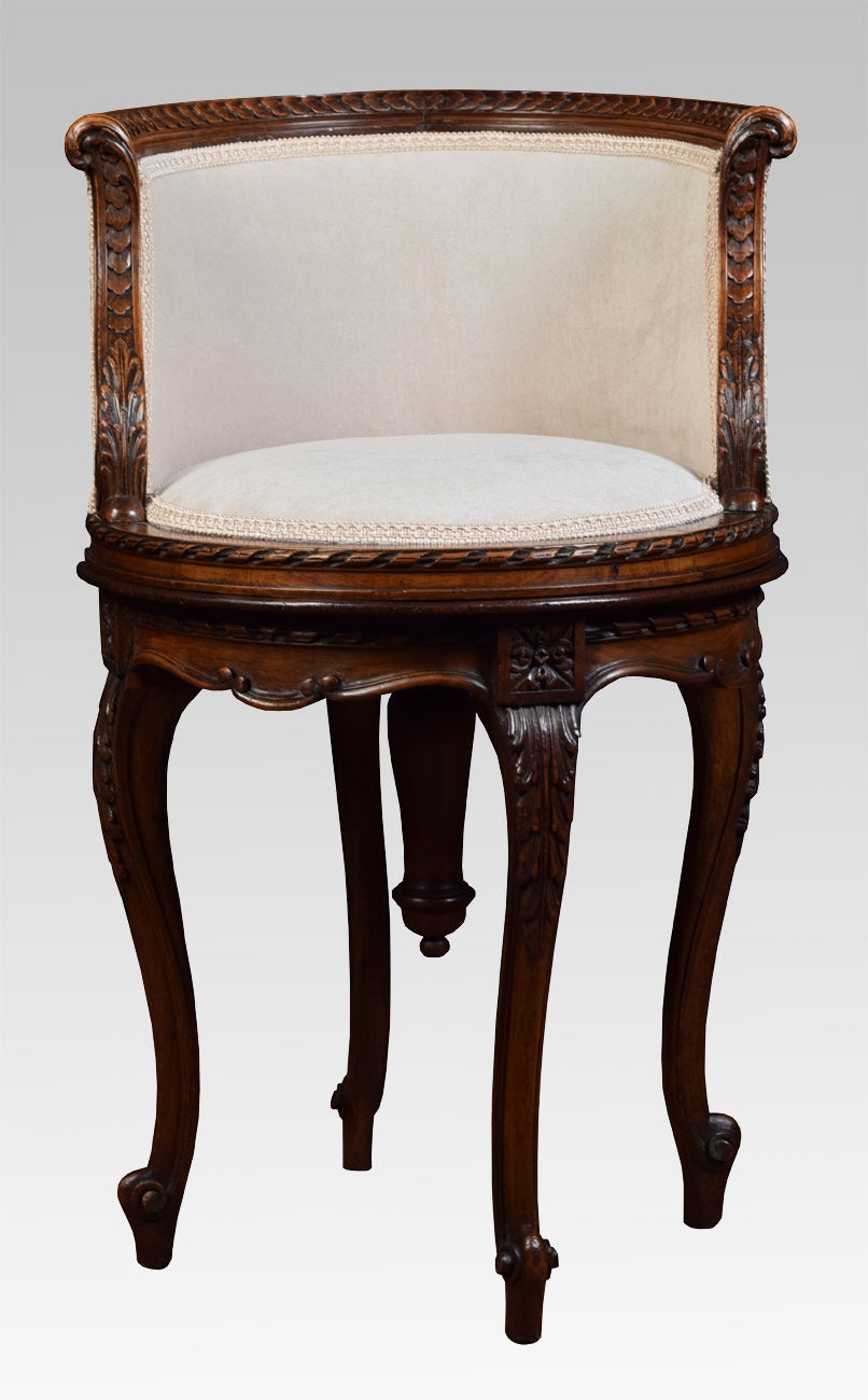 late 19th Century carved and upholstered walnut ladys dressing stool, having low horseshoe back, circular screw-adjustable seat and acanthus carved cabriole legs with volute feet

Dimensions

Height 30 Inches Height to seat 21 Inches Adjustable