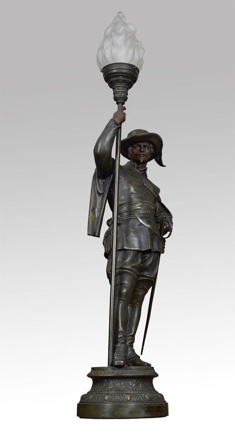 Albert Carrier-Belleuse - Hallebardier, a late 19th Century French spelter renaissance soldier whereing his traditional robe, one hand clenching his sword the other a flaming torch.(has been re-wired)

Dimensions

Height 40 Inches