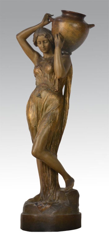 Large terracotta figure of a Art Nouveau figure of a Water Carrier modelled as a maiden in ling cascading dress, she carries aloft a large twin-handled amphora
signed 'Gross', Goldscheider Wien Plaque, numbered'2616 396 17