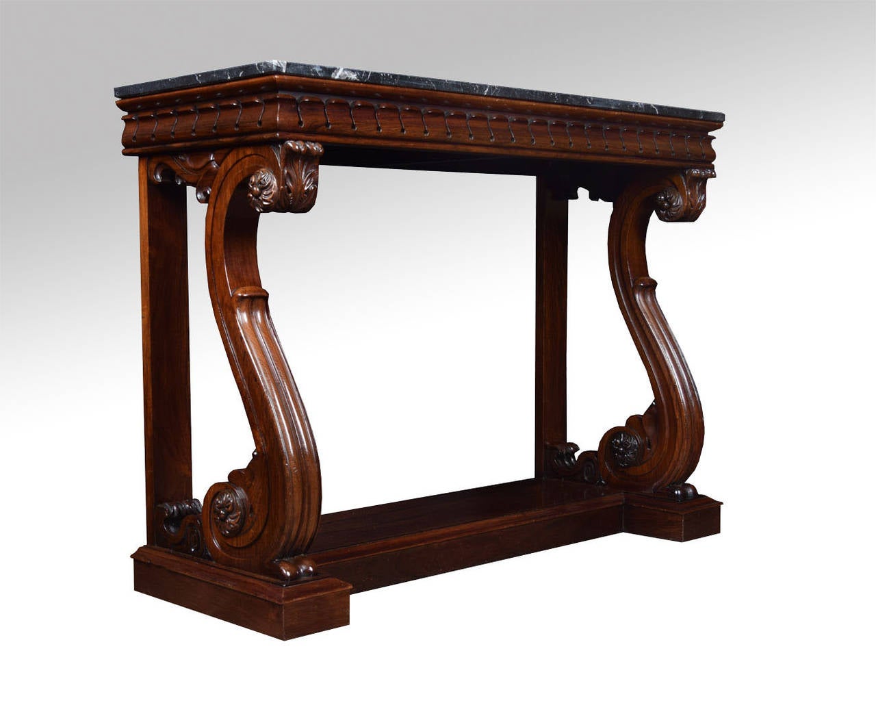 George IV rosewood console table, the rectangular black vined marble top above moulded freeze raised on a pair of carved acanthus leaf scroll supports all raised up on a plinth base

Dimensions

Height 36 Inches

Width 48.5 Inches

Depth