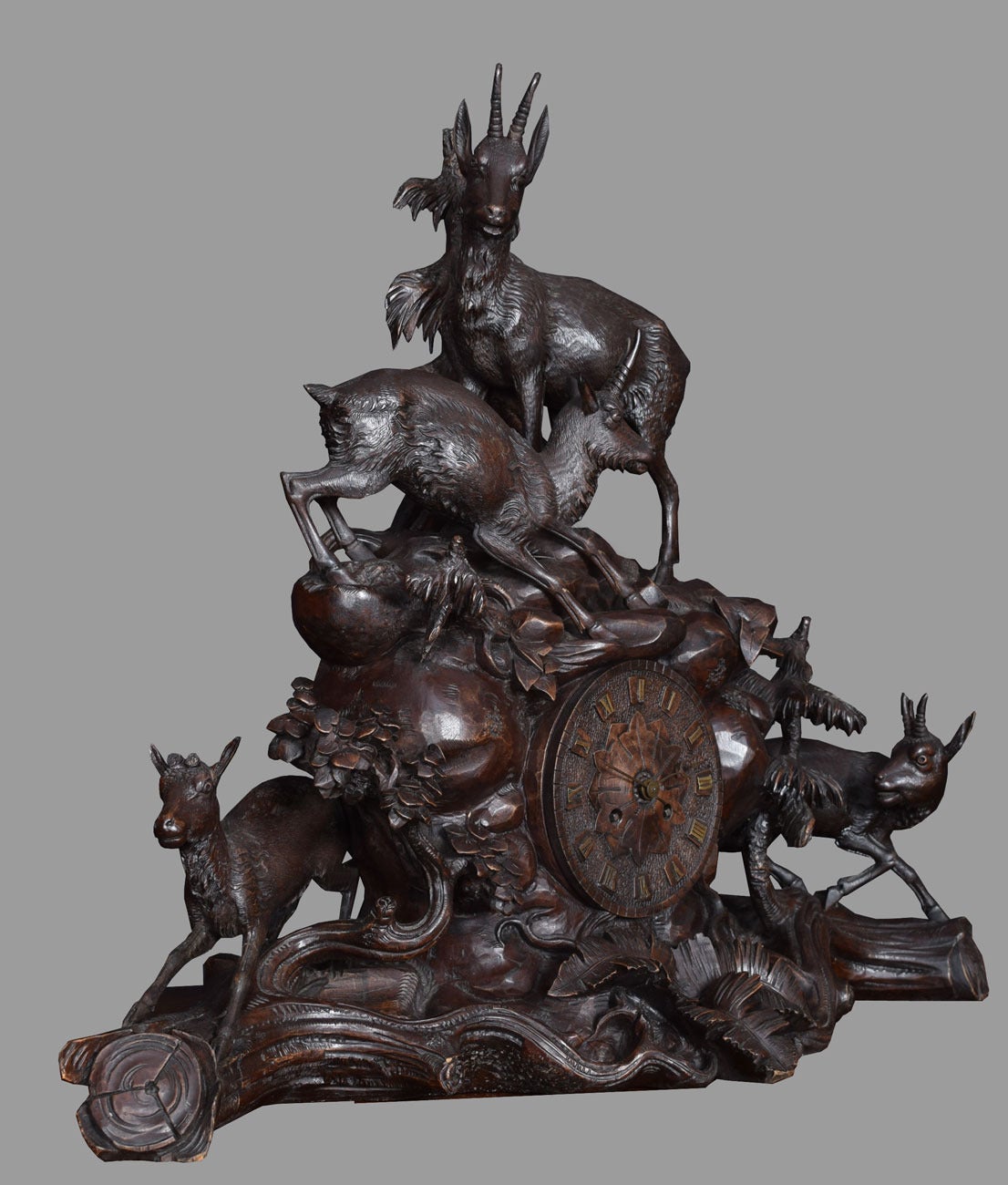 Rare 19th century Black Forest' carved wood three-piece clock set, the clock with 6ins carved wood dial to the French eight day two train movement striking on a bell by Marti & Cie, contained in case boldly carved in the form of a rocky outcrop