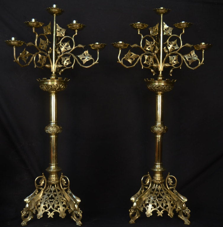19th century brass Ecclesiastical candelabra, the seven branches cut with scrolling foliate supports, raised up on scrolling dragons