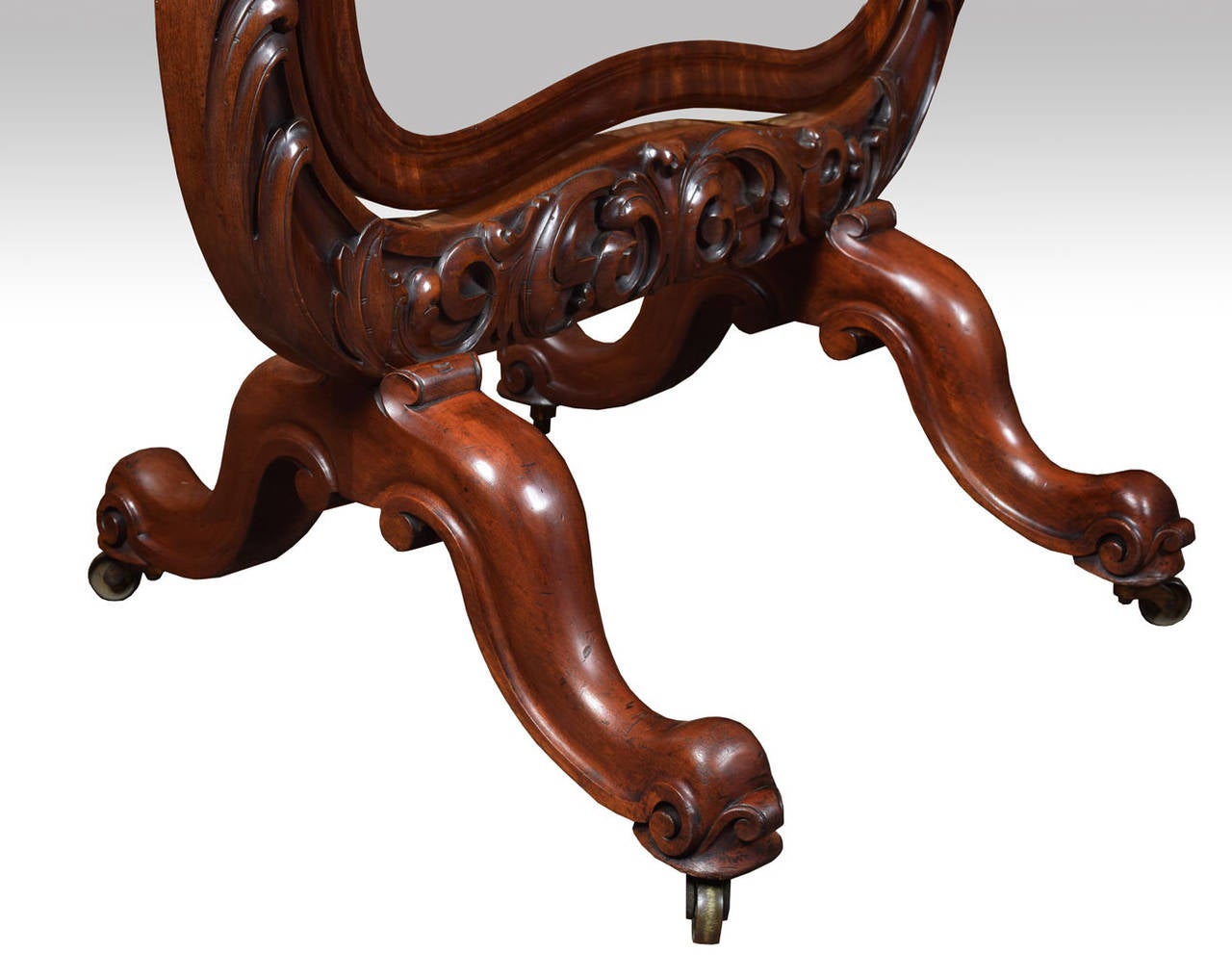 An early Victorian mahogany cheval mirror, the cartouche-shaped plate mirror, supported by a moulded frame having scrolled tendrils raised up on scrolled legs and brass cators.
Dimensions:
Height 67.5 inches
Width 36 inches
Depth 25.5 inches.