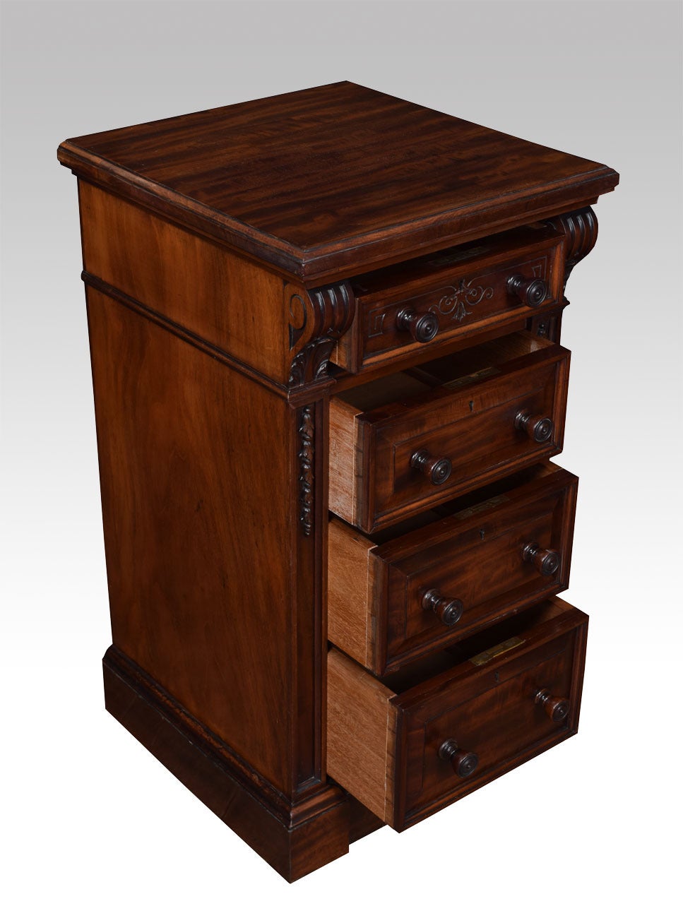 Pair of mahogany miniature wellington chests, the rectangular top above four graduated short drawers with turned wooden handles between corbelled uprights raised on a plinth base (adapted)
Dimensions
Height 31.5 Inches
Width 17 Inches
Depth 17.5
