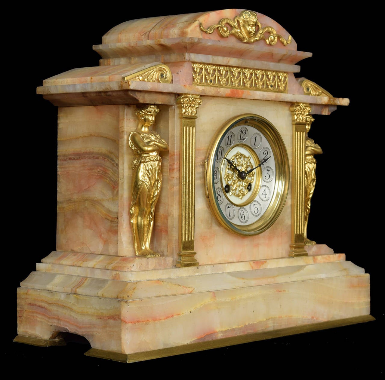 Late 19th century French gilt metal and onyx cased three-piece clock garniture, the clock by Japy Freres, No. 5940, the 4.25ins silvered chapter ring with Arabic numerals to the eight day two train movement striking on a gong, contained in onyx and