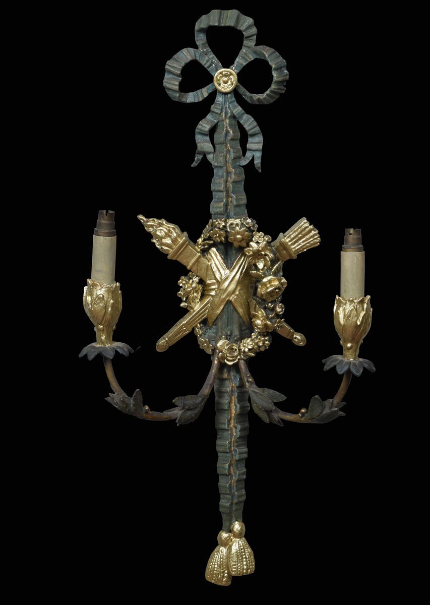 Set of four twin-arm painted wall lights the ribboned top above the scrolling  foliated arms having central cartouche shaped back plates with decoration, Original wiring needs checking

Dimensions

Height 26 Inches

Width 12 Inches

Depth 6