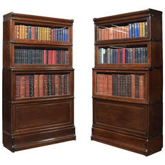 Pair Oak globe Wernicke four section bookcases
